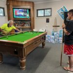 After a hard day, a game of pool at basecamp